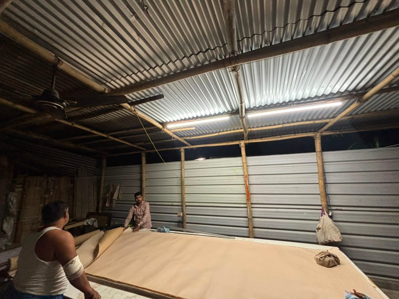Our team processing jute fabric rolls at the workshop